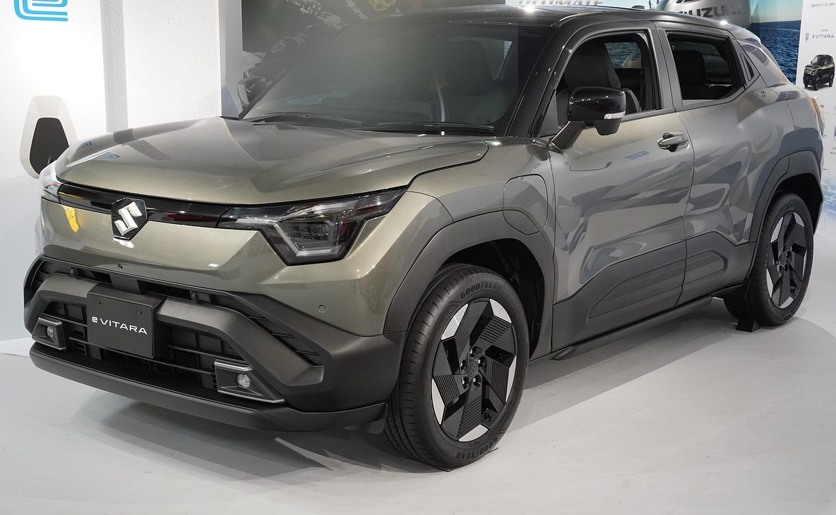 Suzuki e Vitara in grey-green on display in Hamamatsu, Japan, front three-quarter view