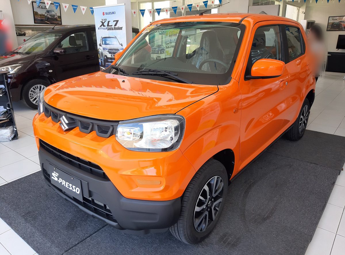 Suzuki S-Presso in orange in a showroom in the Philippines, front three-quarter view
