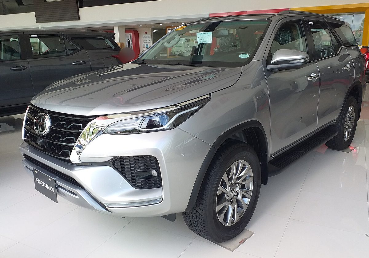 Toyota Fortuner in silver in a dealer showroom in the Philippines, front three-quarter view